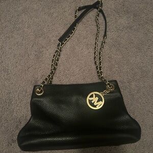 Black Michael kors crossbody shoulder purse with gold chain